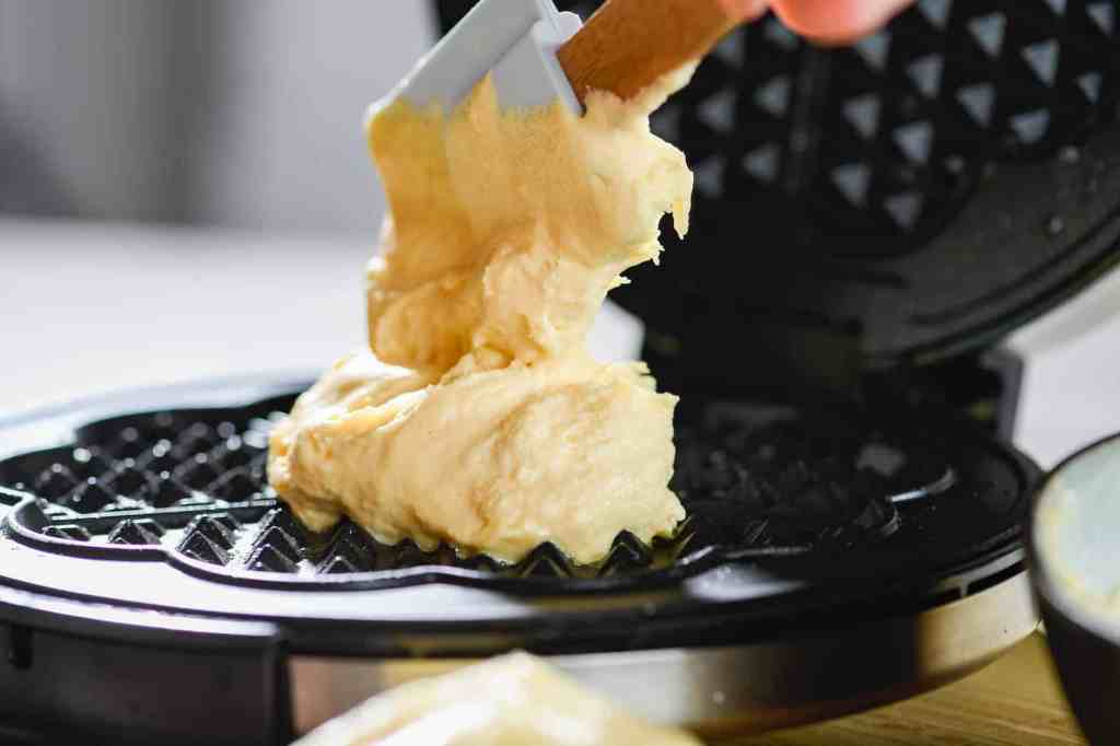 raw dough in waffle maker